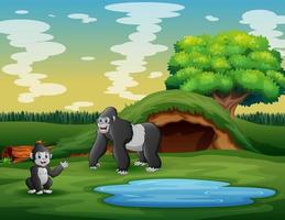 Cartoon a mother gorilla with her cub in the meadow vector