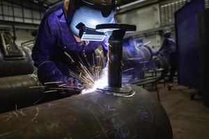 Welding male worker metal is part in machinery nozzle pipeline construction