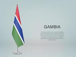 Gambia colgando la bandera en el stand. vector