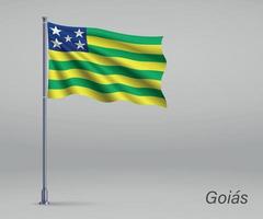 Waving flag of Goias - state of Brazil on flagpole. vector