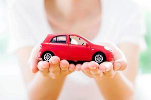 Hand with car. Auto dealership and rental concept background. photo