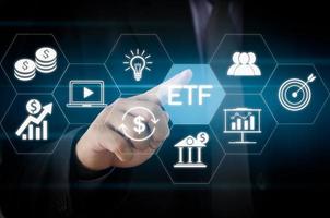 Hand businessman icon ETF Exchange Traded Fund virtual screen Internet Business stock market finance Index Fund Concept.
