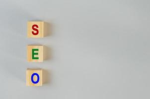 wooden cubes for SEO Search engine optimization  on gray background.Copy space. photo