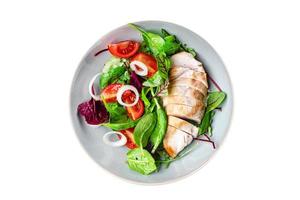 salad chicken breast vegetable tomato, onion, green mix leaves photo