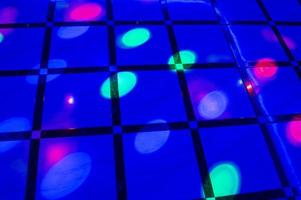 illuminated floor with colored spotlights photo