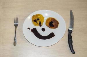 two pancakes with lipstick in the form of a smile photo