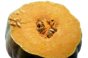 piece of cut yellow pumpkin with grains photo