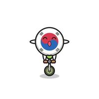 The cute south korea flag character is riding a circus bike vector