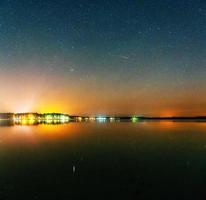 fantastic winter meteor shower and the snow-capped mountains. photo