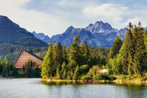 The sunrise over a lake in the park High Tatras. Shtrbske Pleso, photo