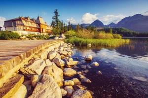 The sunrise over a lake in the park High Tatras. Shtrbske Pleso, photo