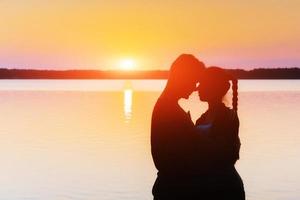 couple on the bike at sunset photo