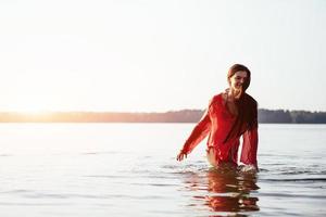 cute girl bathes in water photo