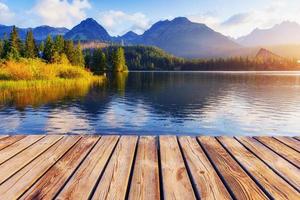 The sunrise over a lake in the park High Tatras. Shtrbske Pleso, photo