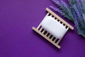 Homemade soap with dried lavender on table with copy space photo