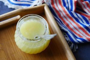 homemade ghee in container on a table , photo