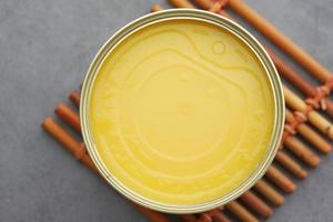 homemade ghee in container on a table , photo