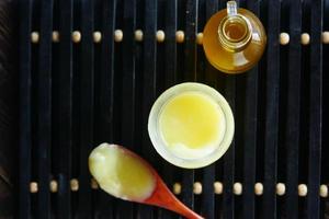 homemade ghee in container on a table , photo