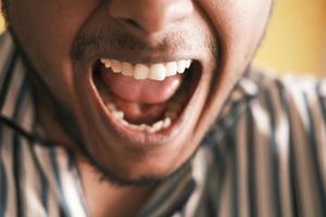 young man screaming at camera photo