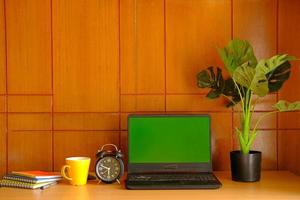 laptop with blank screen on office desk. photo