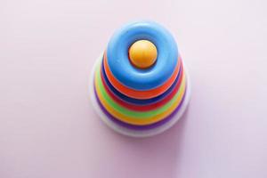 Baby toys on color background. Child development concept. photo