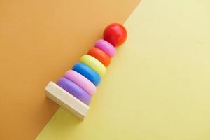 Baby toys on color background. Child development concept. photo