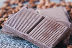 dark chocolate and coffee beans on table photo