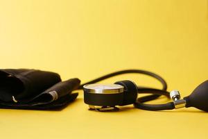 blood pressure machine on yellow background photo