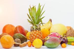 Exotic fruits isolated on white background. Healthy eating dieting food. Pitahaya, carambola, papaya, baby pineapple, mango, passion fruit, tamarind and other.