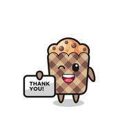la mascota del muffin sosteniendo una pancarta que dice gracias