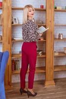 cheerful smiling blonde professional business lady in office photo