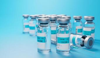 COVID 19 vaccine on blue background photo