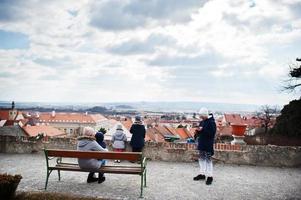 Family walking at historical Mikulov Castle, Moravia, Czech Republic. Old European town. photo