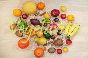 Exotic fruits with vegetarian sign. Healthy eating dieting food background. photo