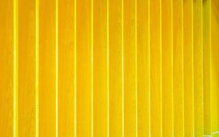 Yellow lath wooden wall, wall wooden lath photo