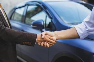 Handshake for deal buying car photo