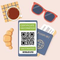 Certificate of vaccination against COVID-19 coronavirus with QR code on smartphone screen. Top view of table in airport cafe. Passport with ticket, sunglasses, cup of coffee, croissant