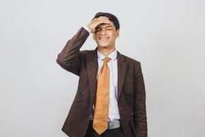 Sad asian young businessman having headache photo