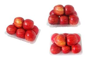 Set of Red apples in a clear plastic package isolated on white background. photo