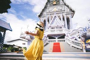 Back view of solo woman asia outdoor local travel wanderlust in Thailand photo