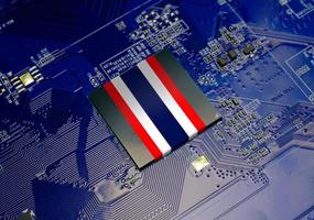 Thai National Flag on CPU operating chipset computer electronic circuit board photo