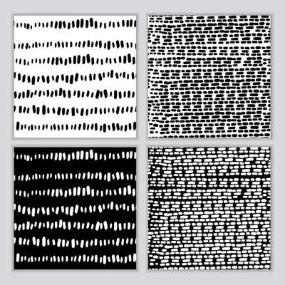 A set of seamless abstract monochrome patterns. Black and white print with wavy lines, dots and spots. Brush strokes are hand-drawn