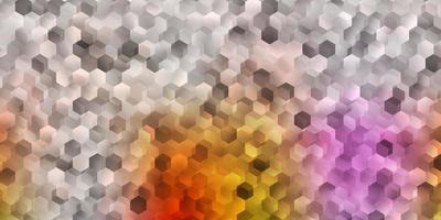 Light pink, yellow vector texture with colorful hexagons.