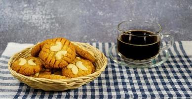 cookies with cashew nuts on the wooden basket,Keto cookies with hot black coffee, ketogenic diet photo