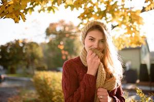 Portrait of a beautiful autumn woman. Girl posing to the camera. photo