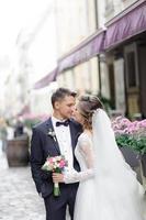 Wedding photo session of a young beautiful couple in the old city.