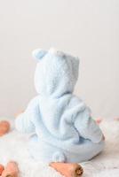 a little girl in a rabbit costume turned away from you photo