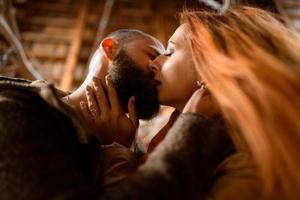 Close up portrait of happy smiling couple in love, guy kissing his girlfriend. photo