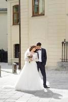 Wedding photo session of a young beautiful couple in the old city.