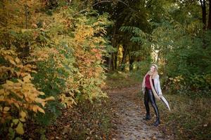 Portrait of a beautiful autumn woman. Girl posing to the camera. photo